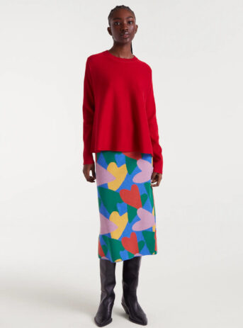 53C10206_04 Falda midi de punto con estampado Cupido, cintura elástica, tiro medio y abertura trasera. Disponible en Dulce Locura, tienda de moda en Badajoz.